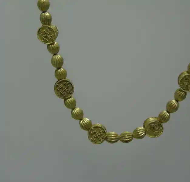 A prechristian gold necklace that looks like a rosary